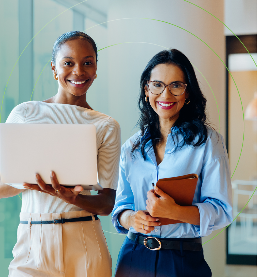 Hero Two Busiiness Ladies one with laptop on notebook Hero Two Busiiness Ladies one with laptop on notebook